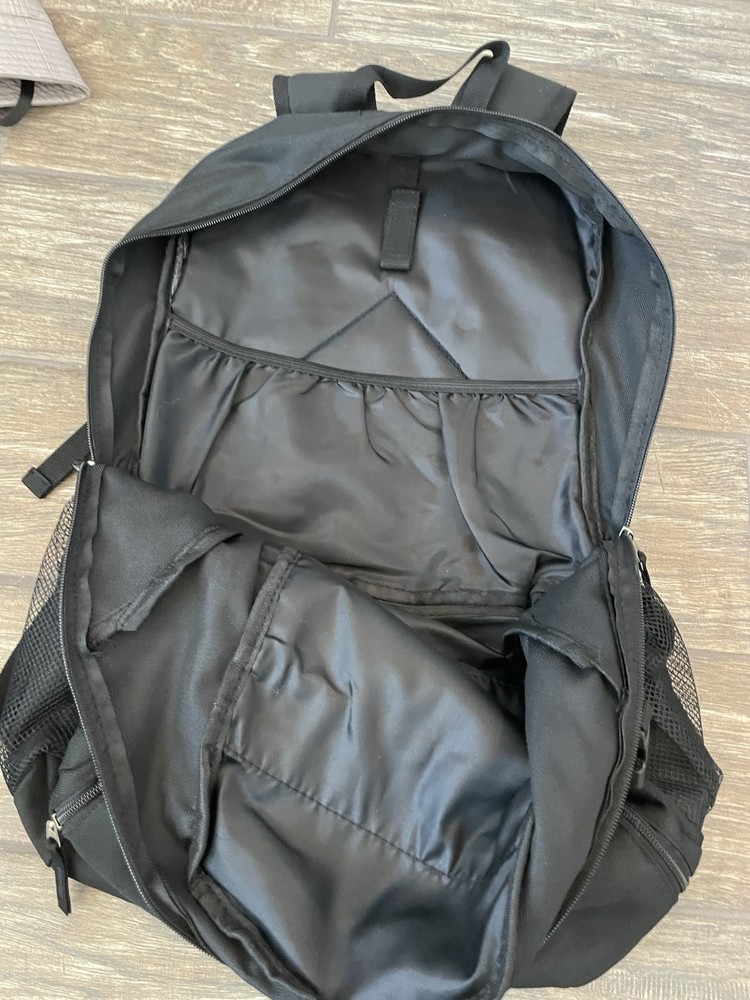 IRONMAN Triathlons, Backpack, Non Race Specific. Features The M-Dot Logo