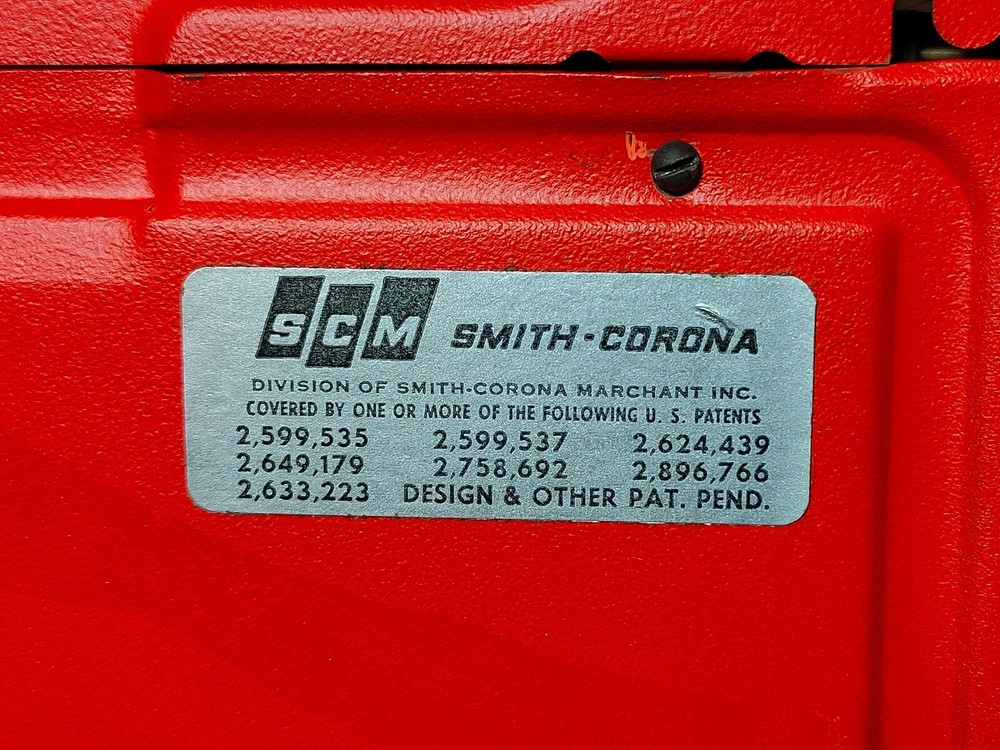 red, portable Smith Corona Galaxie typewriter with Cursive / Handwritten Script