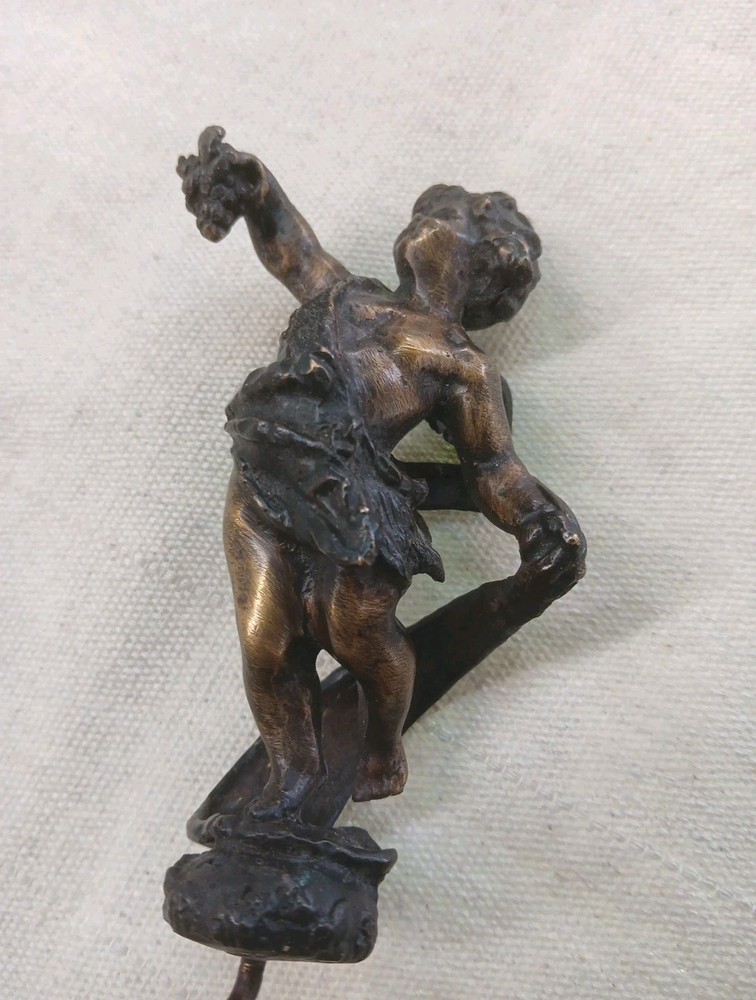 COLLECTABLE BRONZED CORKSCREW WITH WINGED CHERRUB HANDLE