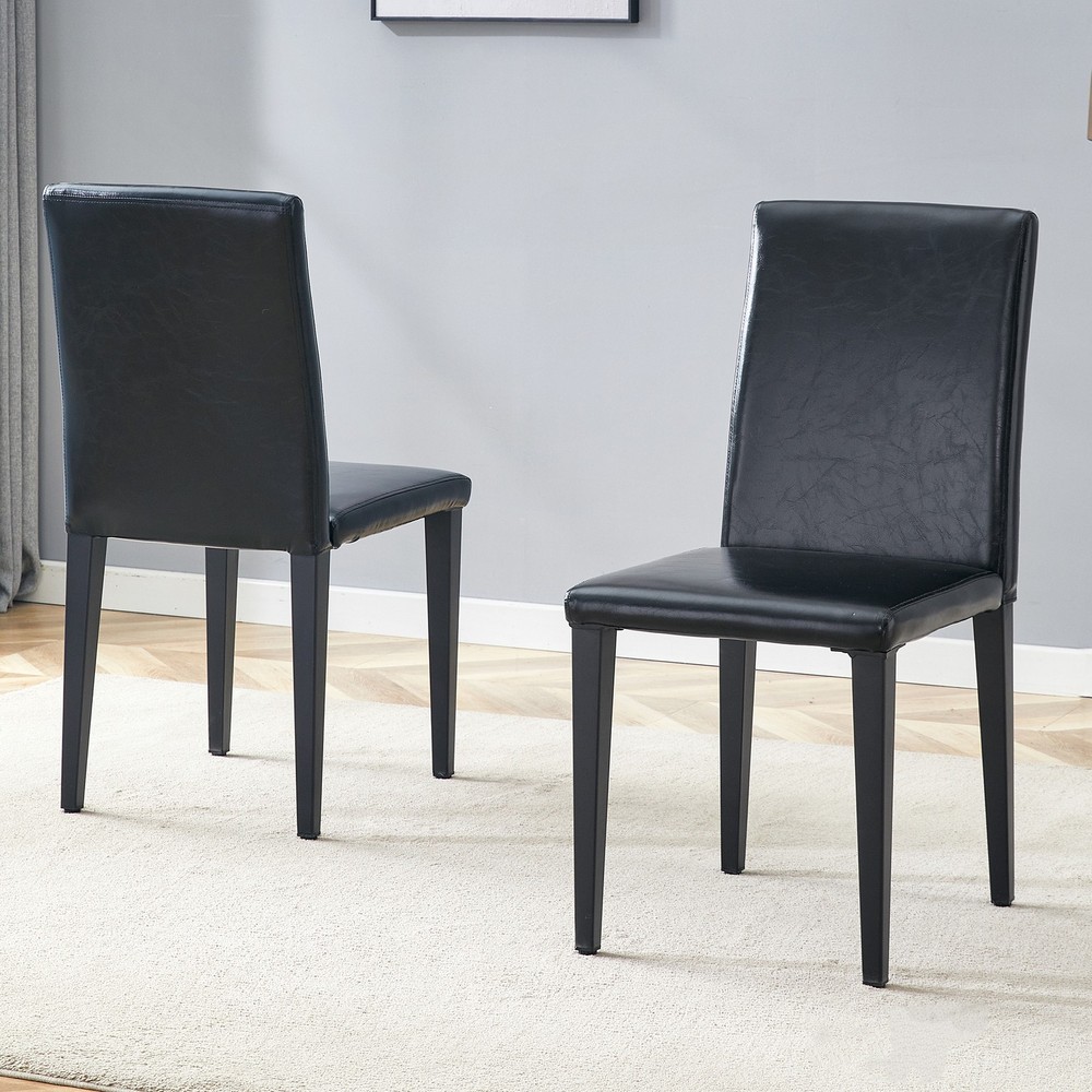Two black PU dining chairs, simple and versatile, comfortable and accompanied.