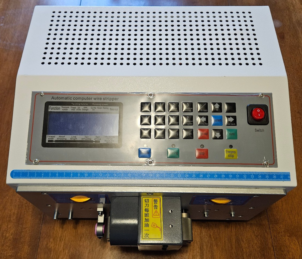 AUTOMATIC COMPUTER WIRE STRIPPING MACHINE