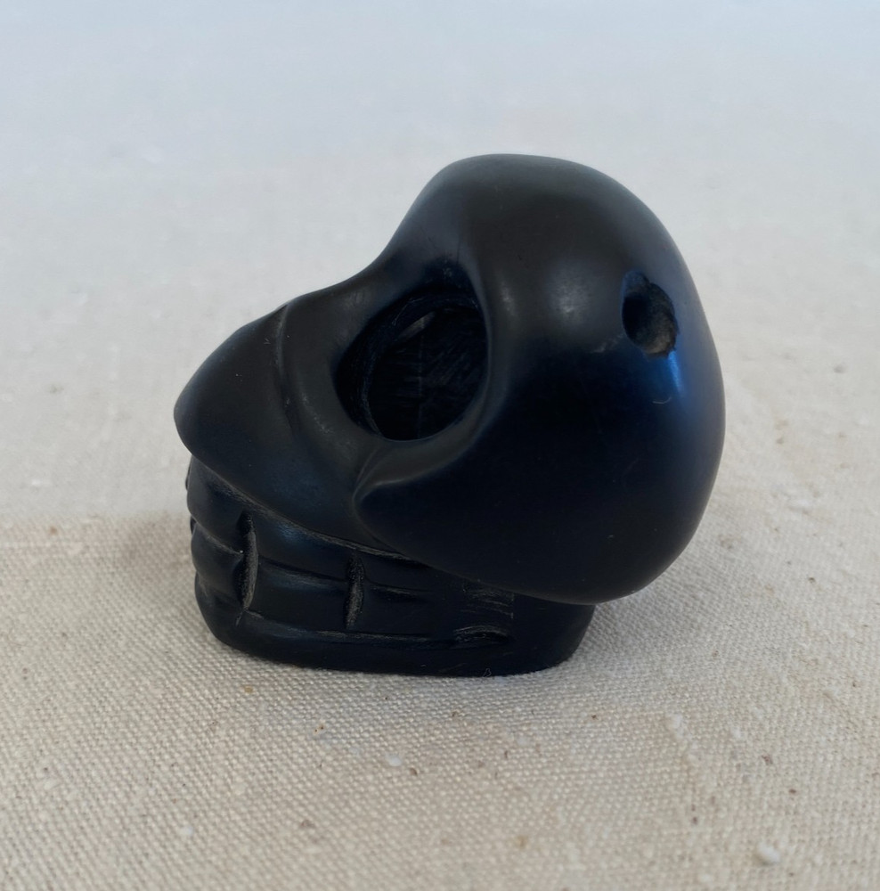 Stylized Carved Stone Skull Pendant