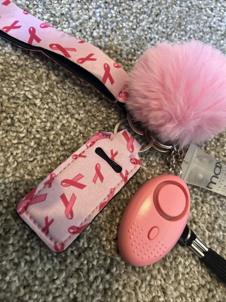 self-defense or safety keychain set with several attached accessories.