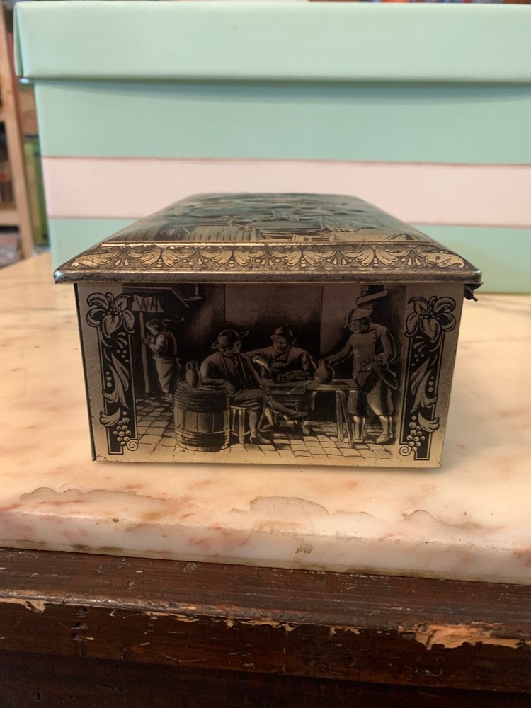 VINTAGE RUBENS EMBOSSED TIN BOX KEYLESS BOX