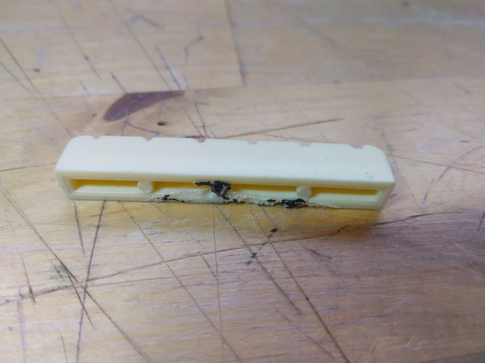 Vintage unbranded Plastic guitar Nut, white