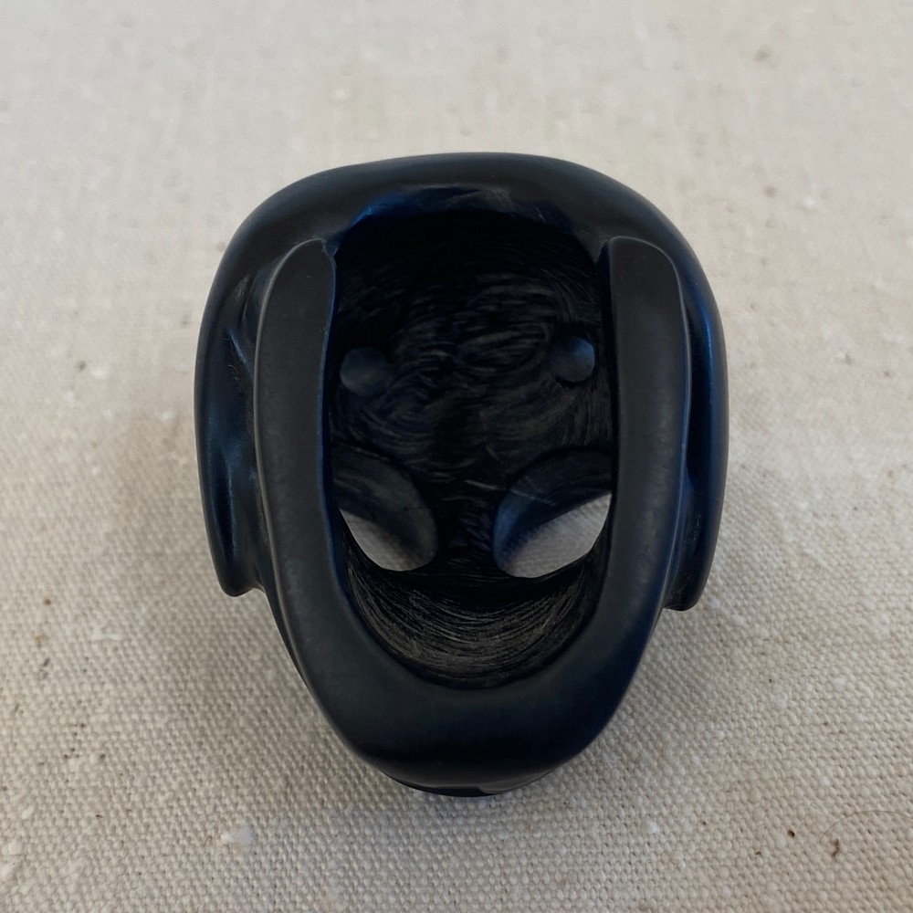 Stylized Carved Stone Skull Pendant