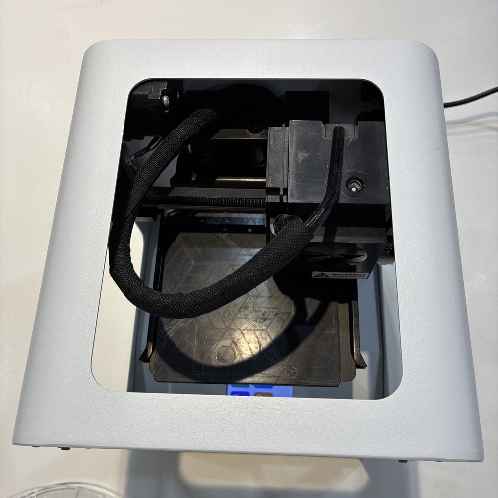 TOYBOX 3D Printer with white printer food.