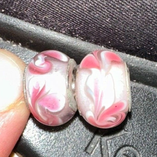two matching pink patterned charms For Charm Braeclets
