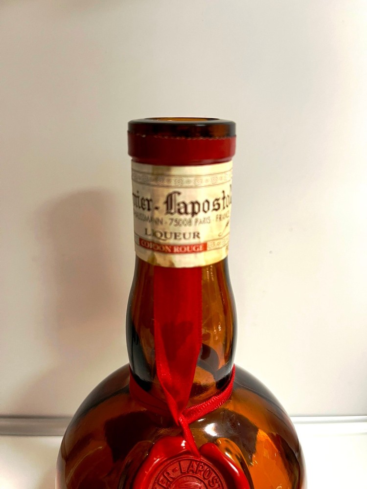 Vintage Grand Marnier bottle (empty) with insulated jacket