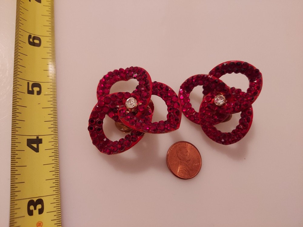 red rhinestone linked intertwined loop statement clip earrings