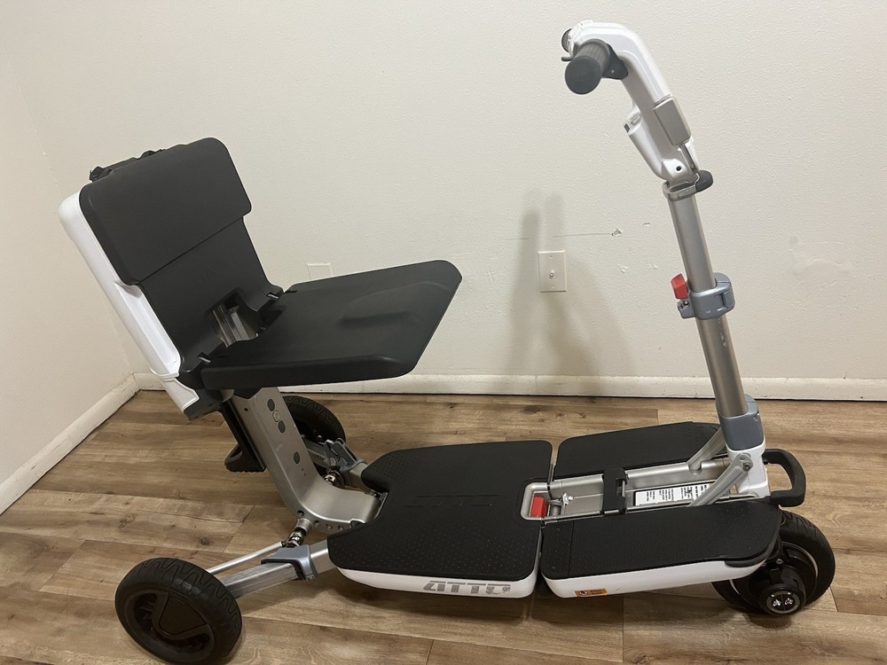 Atto folding scooter color black and white three wheels solid tires