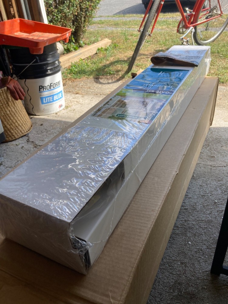 New white with black spindled Veranda gate post.