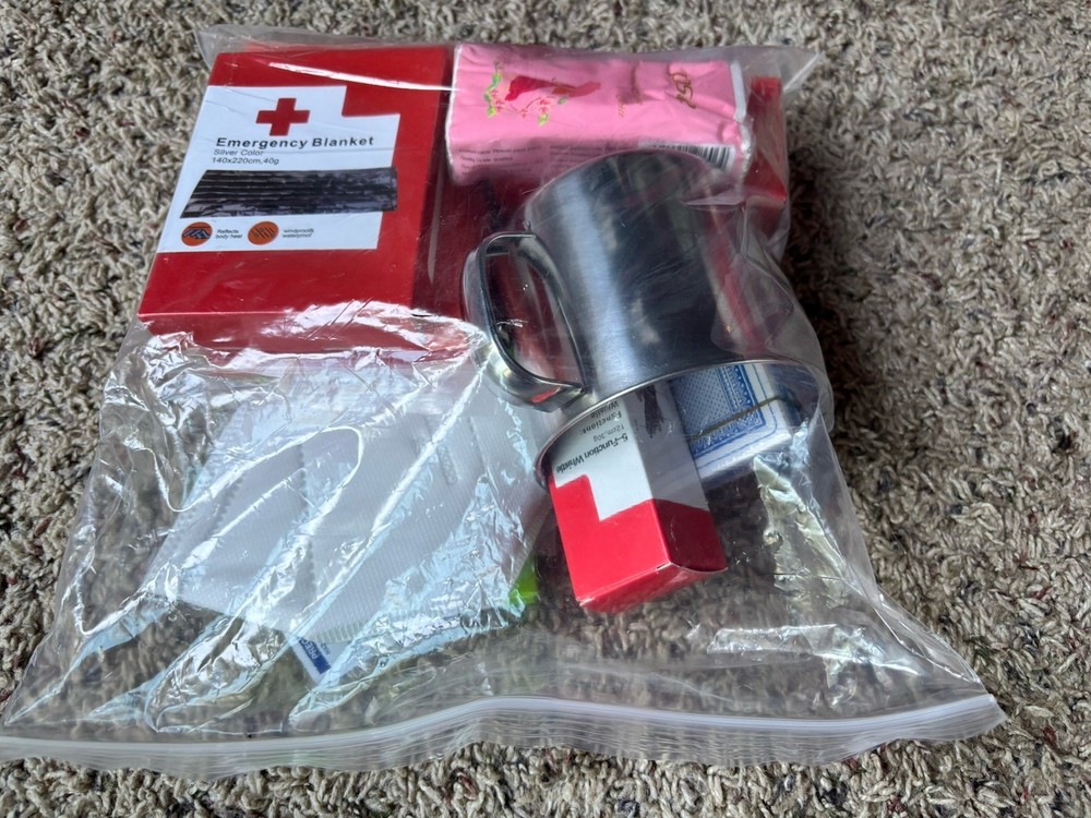 ReadyWise Red White Emergency Survival Backpack (64 piece) open box