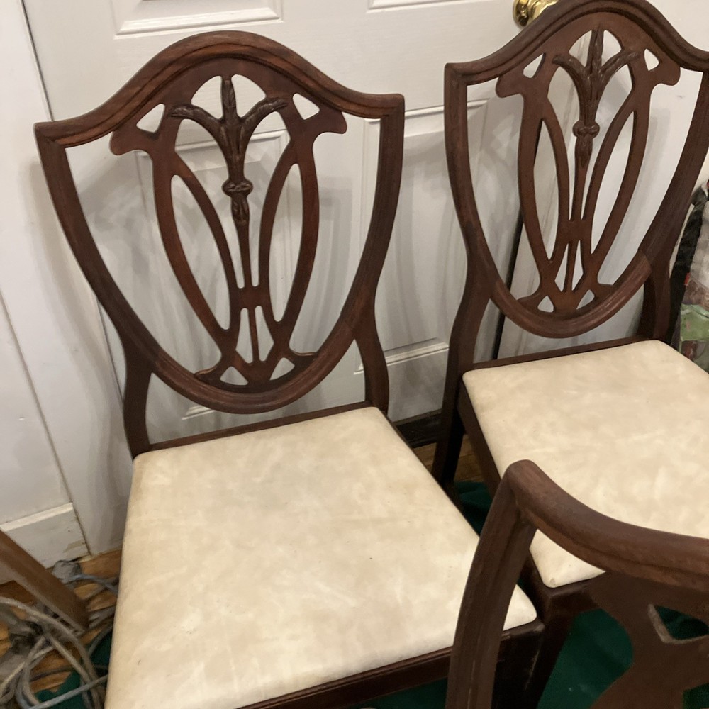 Four matching shield back mahogany dining room chairs