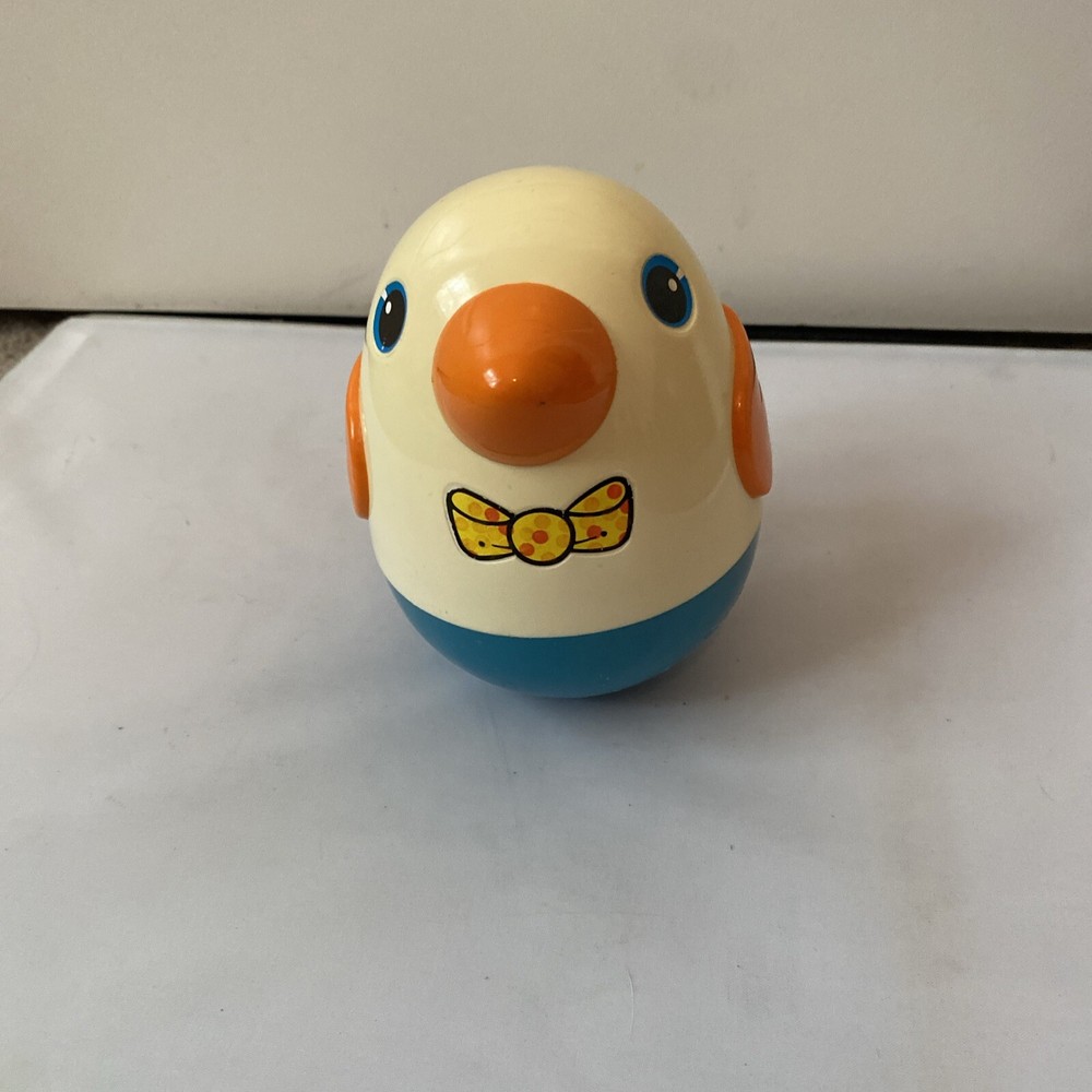Vintage Musical Roly Poly Penguin pull behind toy