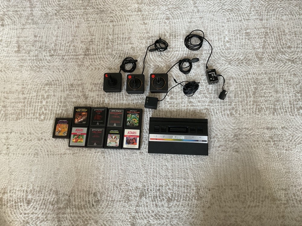 Atari 2600 bundle, games, cables, console, and controllers MAYBE WORKING - black