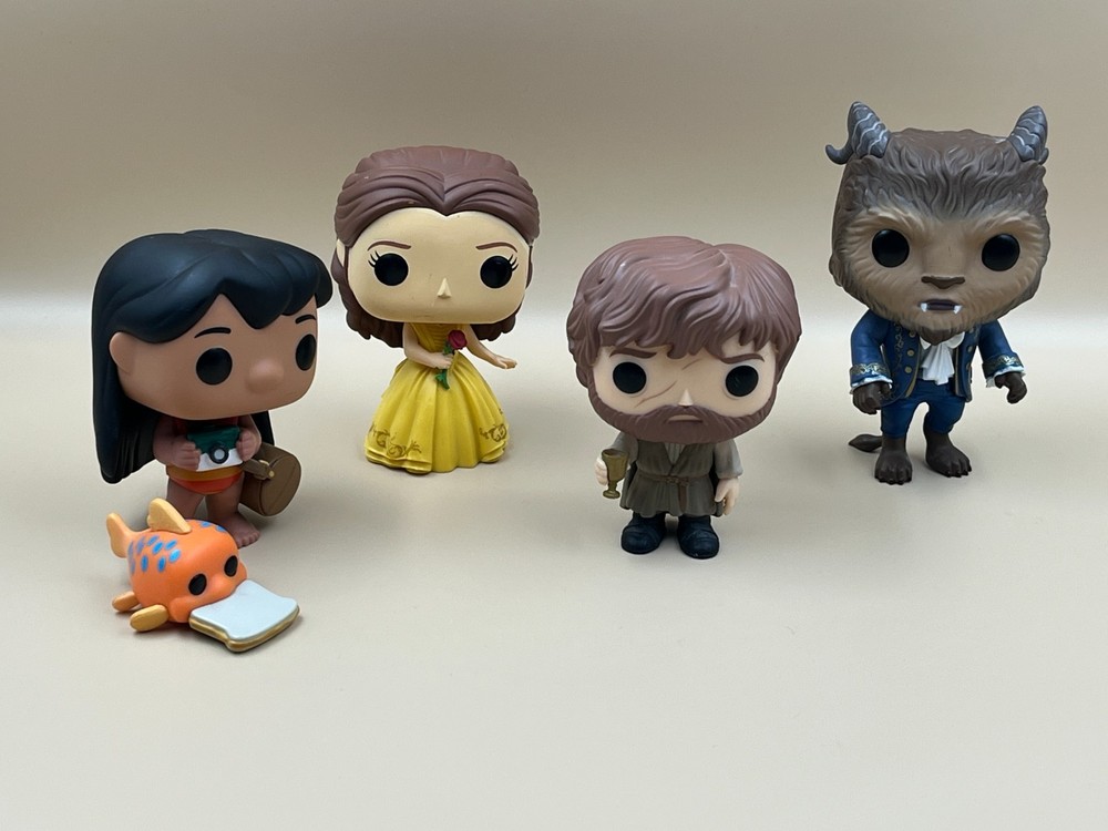 Four Funko Pop Vinyl Figures.
