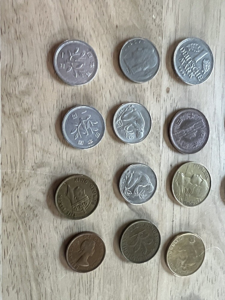 Assorted foreign coins. 26 Coins In Total