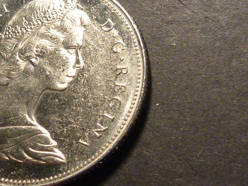 ERROR - Canada 1968 BU 50-cent, large struck-through area (30%) on obverse