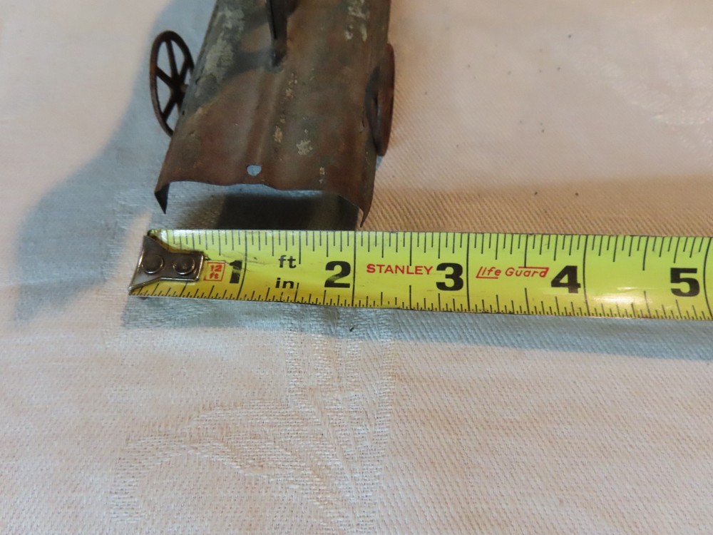 Antique tin dog pull toy