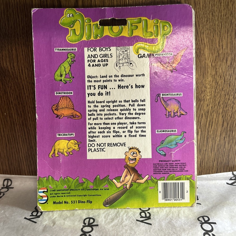 Vintage 1987 Din-o-Flip Handheld Game.