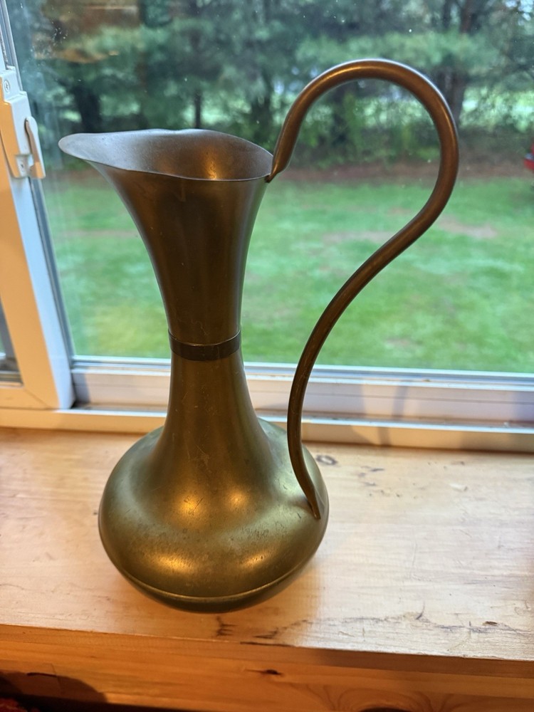 brass watering can