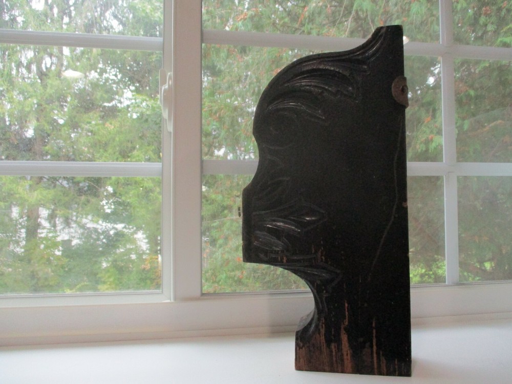 Antique painted black corbel.