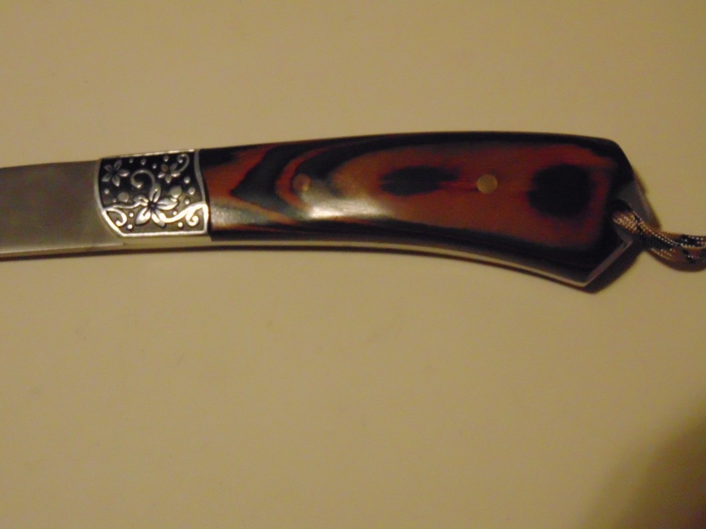 Hatchet With Etched Wolf Face And Wooden Handle