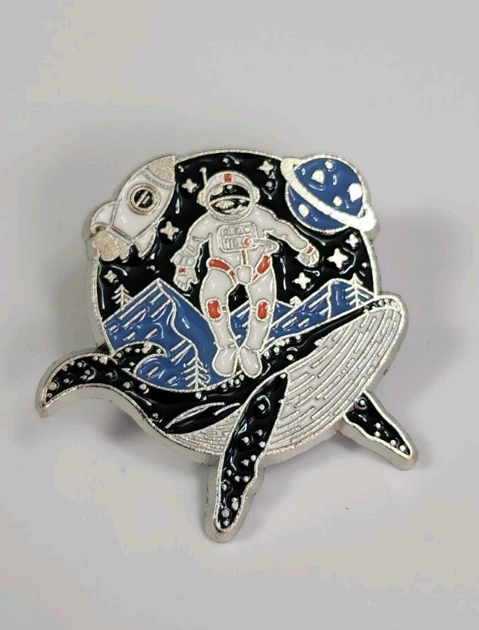Astronaut Riding Whale Rocket Planet Mountains Lapel Pin