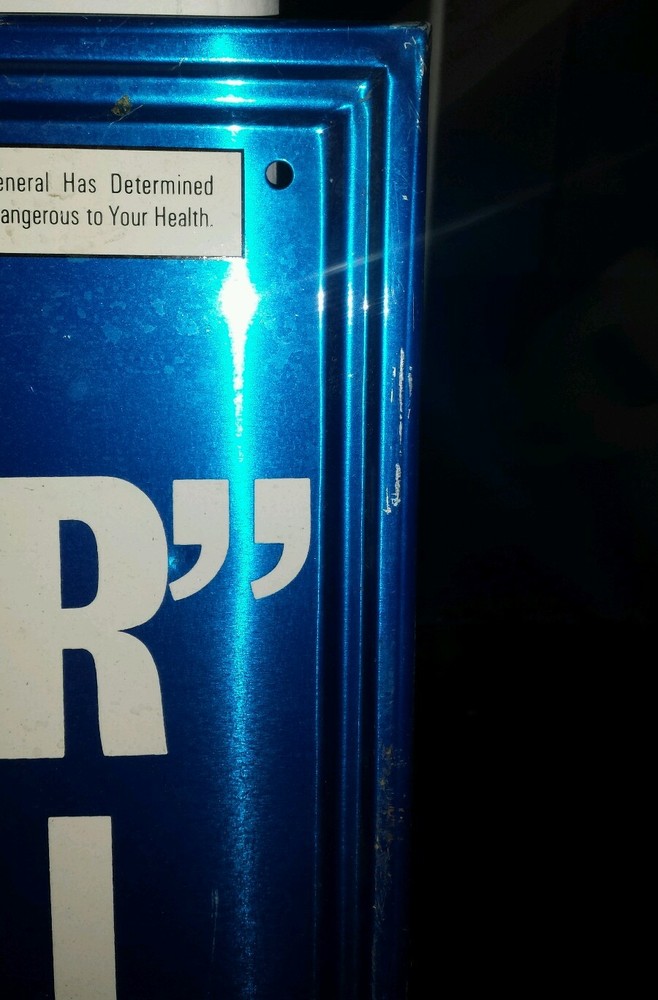 LM cigarette advertising sign.