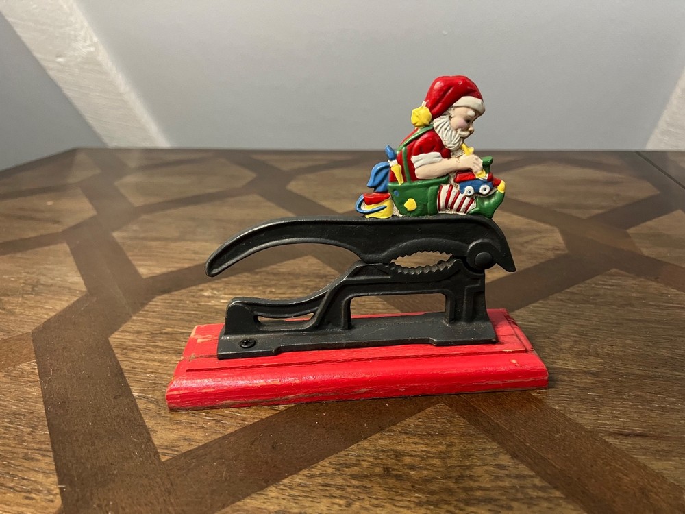 Old Fashioned Nutcracker Cast Iron on Wood Base santa theme nutcracker vintage