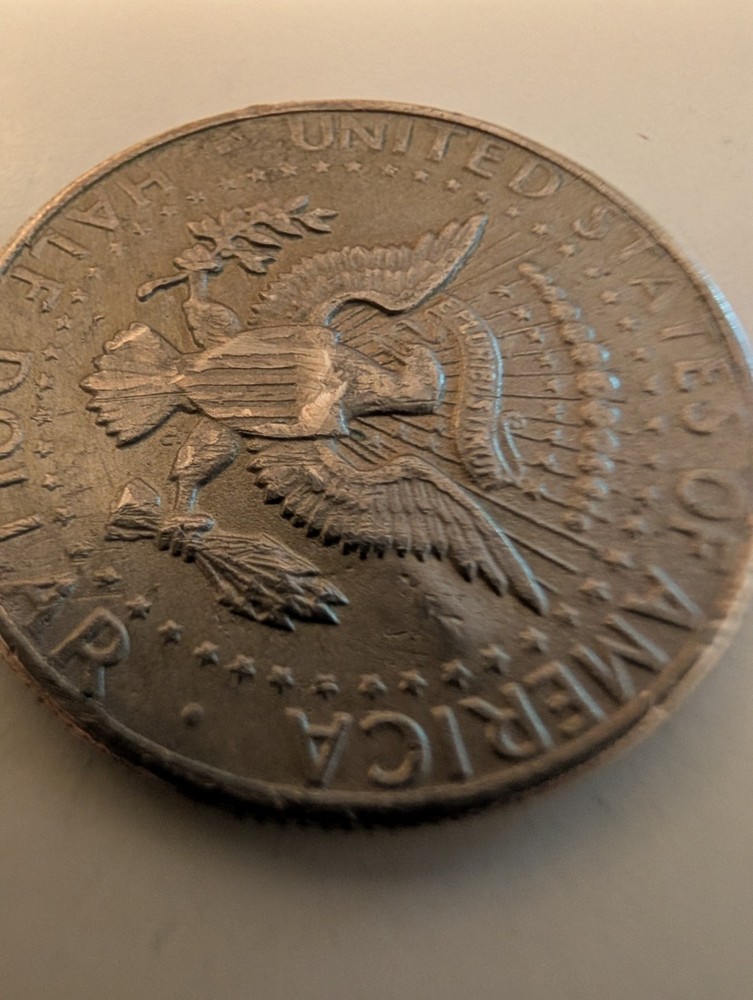 1971 Half Dollar Struck Through Wire And Error On His Cheek