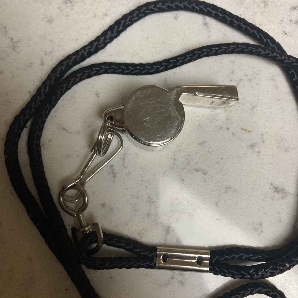 WHISTLE: WINDSOR CLARION BRASS WHISTLE WITH BLACK LANYARD(nice Condition)