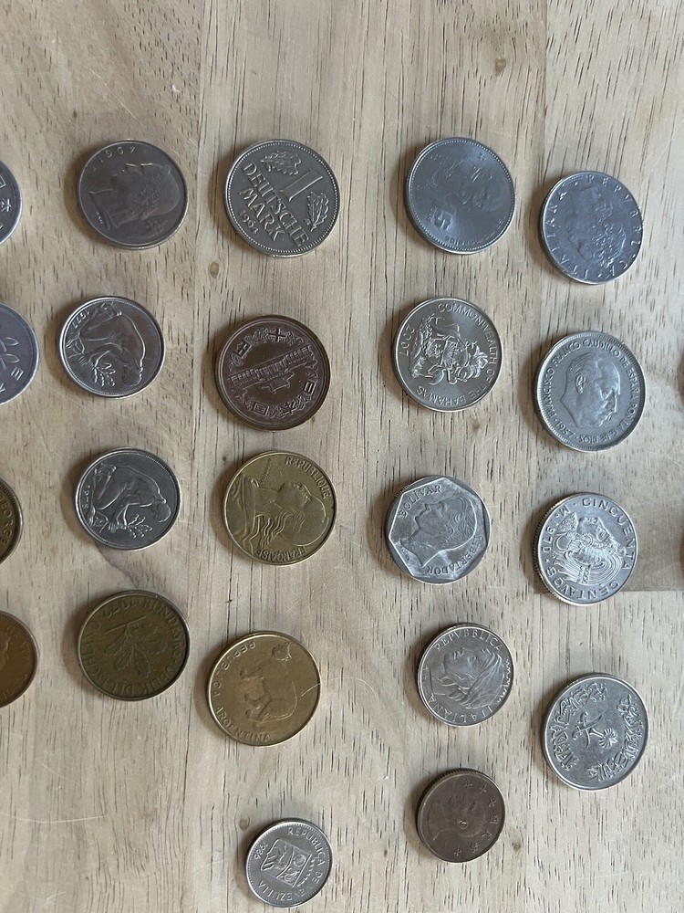 Assorted foreign coins. 26 Coins In Total