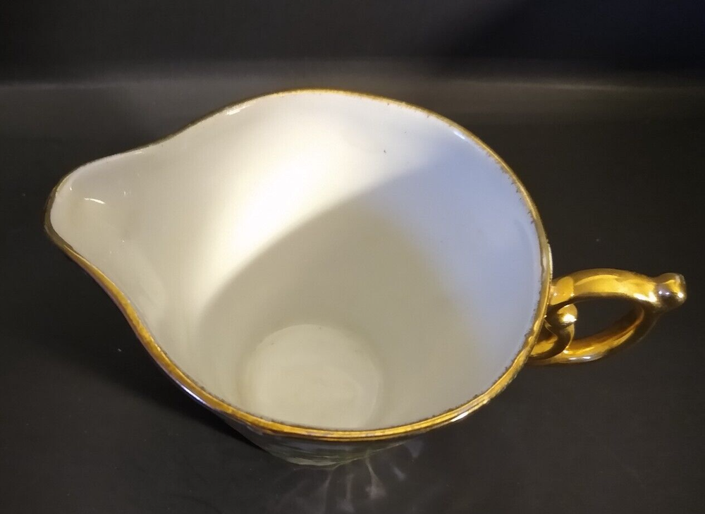Iridescent Holly Creamer unknown maker; two small dark marks under glaze