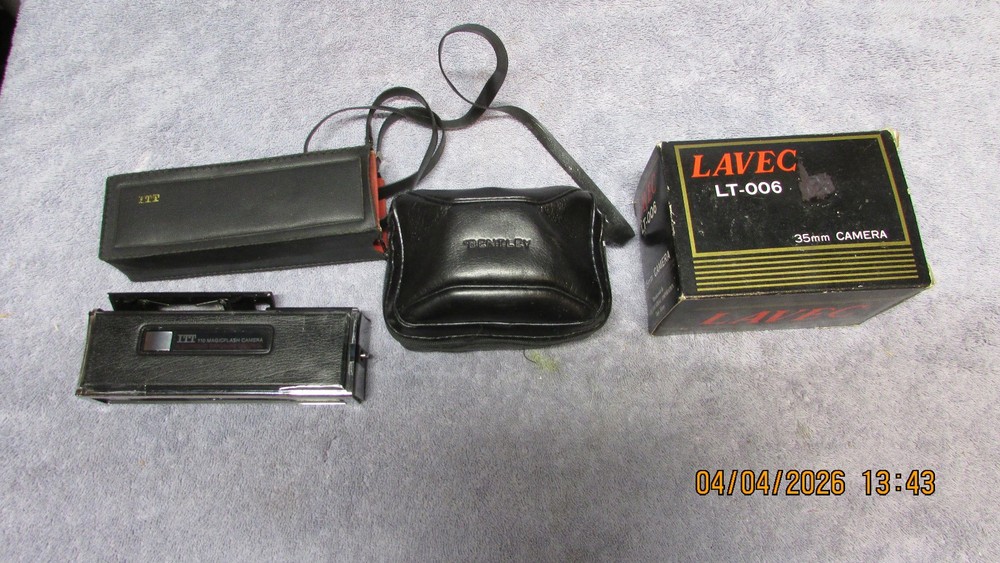 3 vintage cameras.