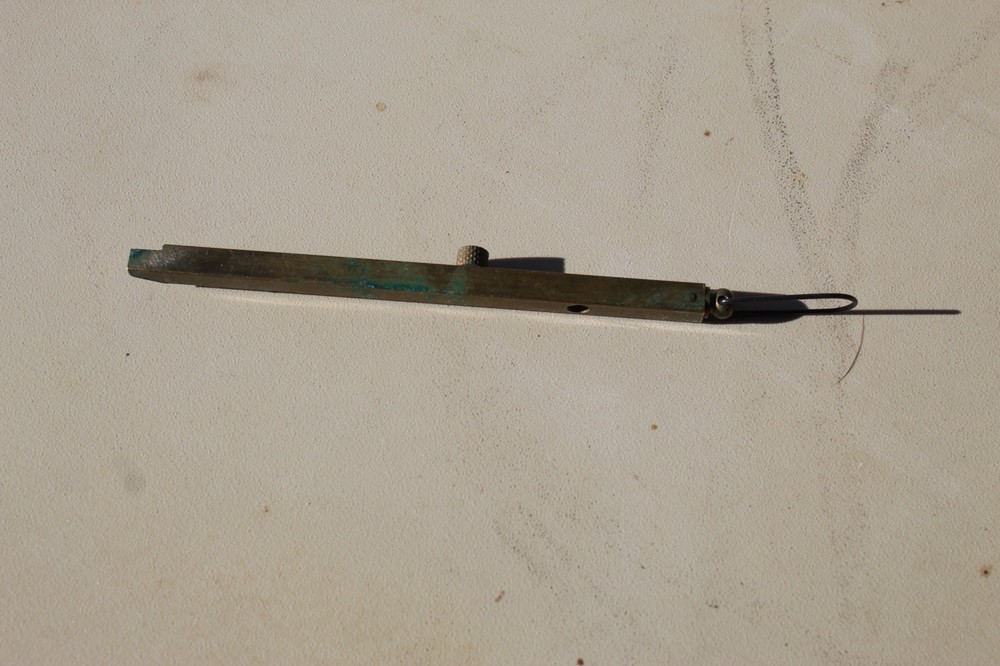 Brass straight-line percussion capper