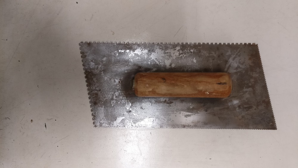 Eight assorted drywall/mud tools