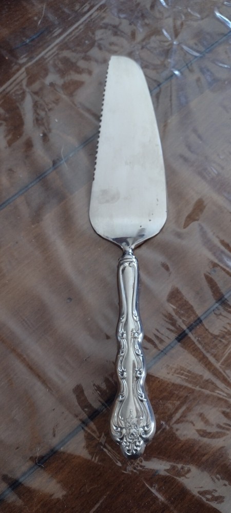 Pie/Cake Server Serrated Edge on one side with ornate design handle