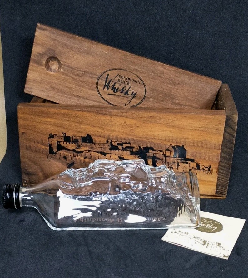 Collectable Edinburgh Rock Whisky bottle and presentation box 10cl. EMPTY.