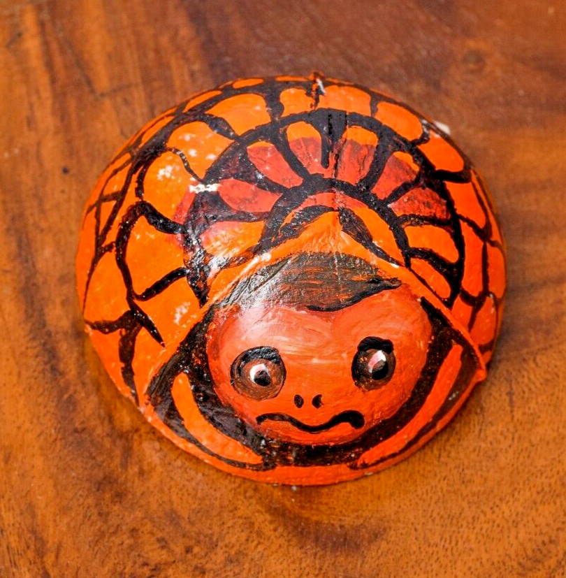 Coconut shells hand painted with different faces specified for hotel decorations