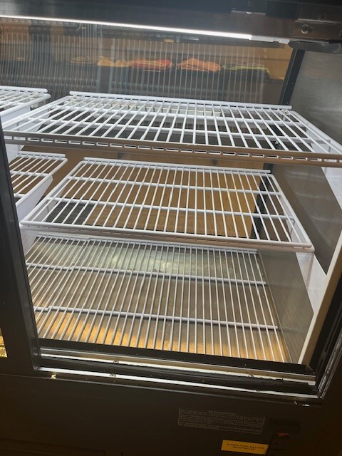 Fogel Mirage 48" refrigerated curved front display case with 3 level display
