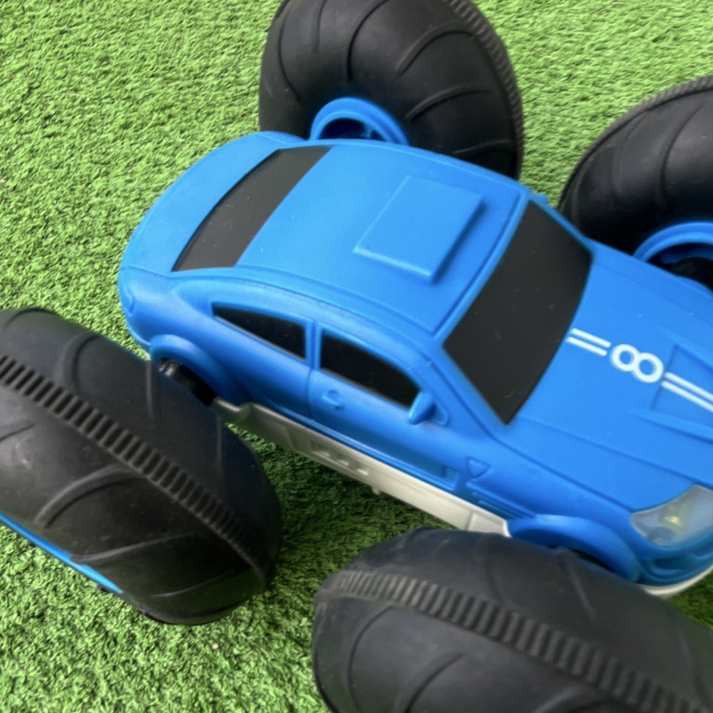 Remote-Controlled Stunt Car Blue White Black Oversized Wheels LED Lights