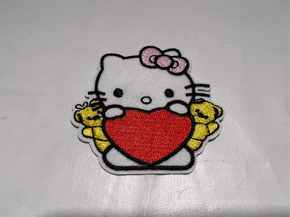 Hello Kitty Holding a Heart Iron on Patch