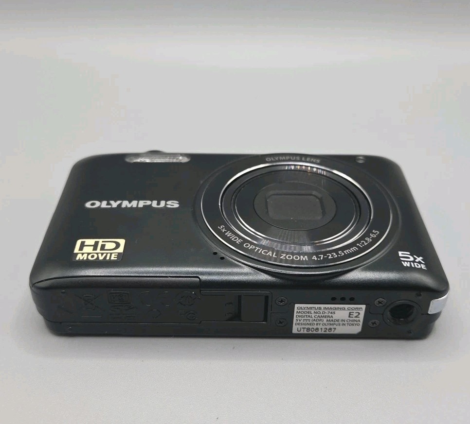 Olympus D-745 Digital Camera And Charging Lead, Black.