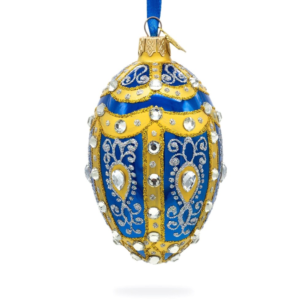 White Scrolls on Blue Glass Egg Ornament 4 Inches