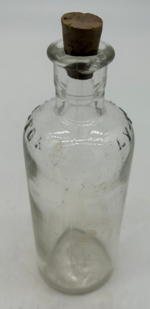 Clear small Fly Tox bottle with cork