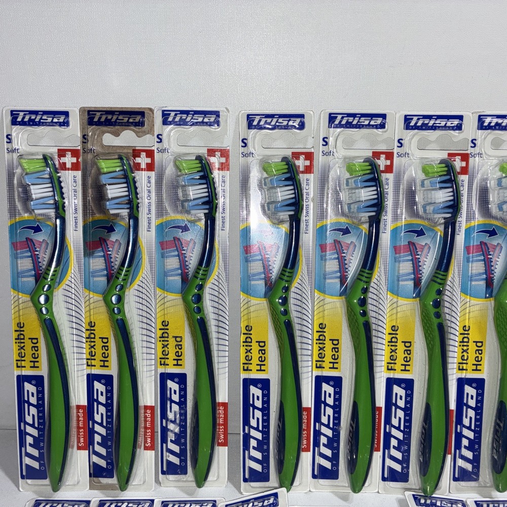 23 Trisa Flexible Head Toothbrushes/ All New