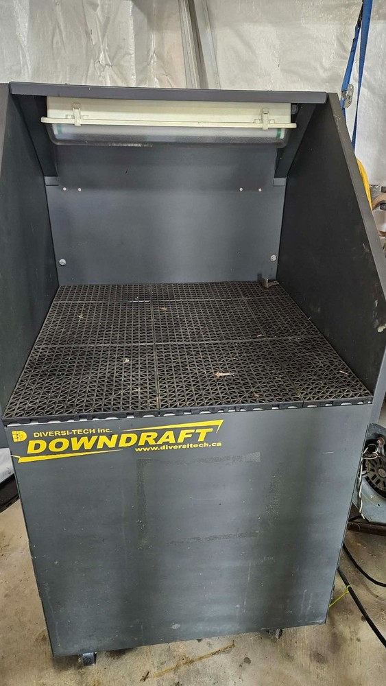 DIVERSI-TECH INC.  down draft bench only used twice. No longer needed