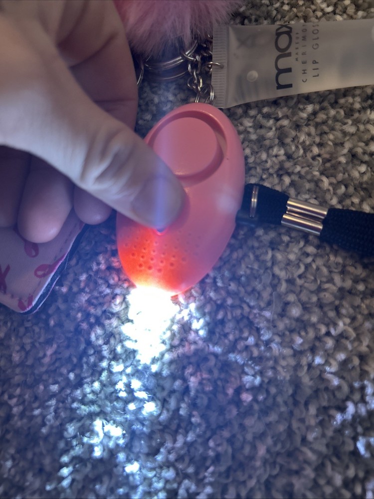self-defense or safety keychain set with several attached accessories.